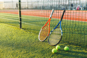 tennis-rackets-grass